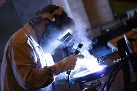 Worker carrying out welding operations